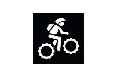 Black pictogram marking a difficult mountain bike route, showing a person riding a mountain bike. | © TVB Piesendorf Niedernsill