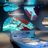 Water Realm exhibition area with underwater images, information panels and interactive elements. | © Ferienregion Nationalpark Hohe Tauern, Foto Franz Reifmüller